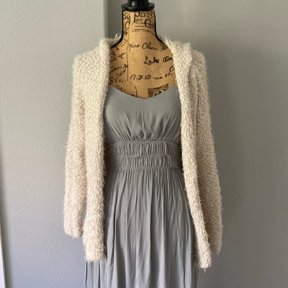 Fuzzy cream color sweater with hood. Size S/M.  Excellent condition.